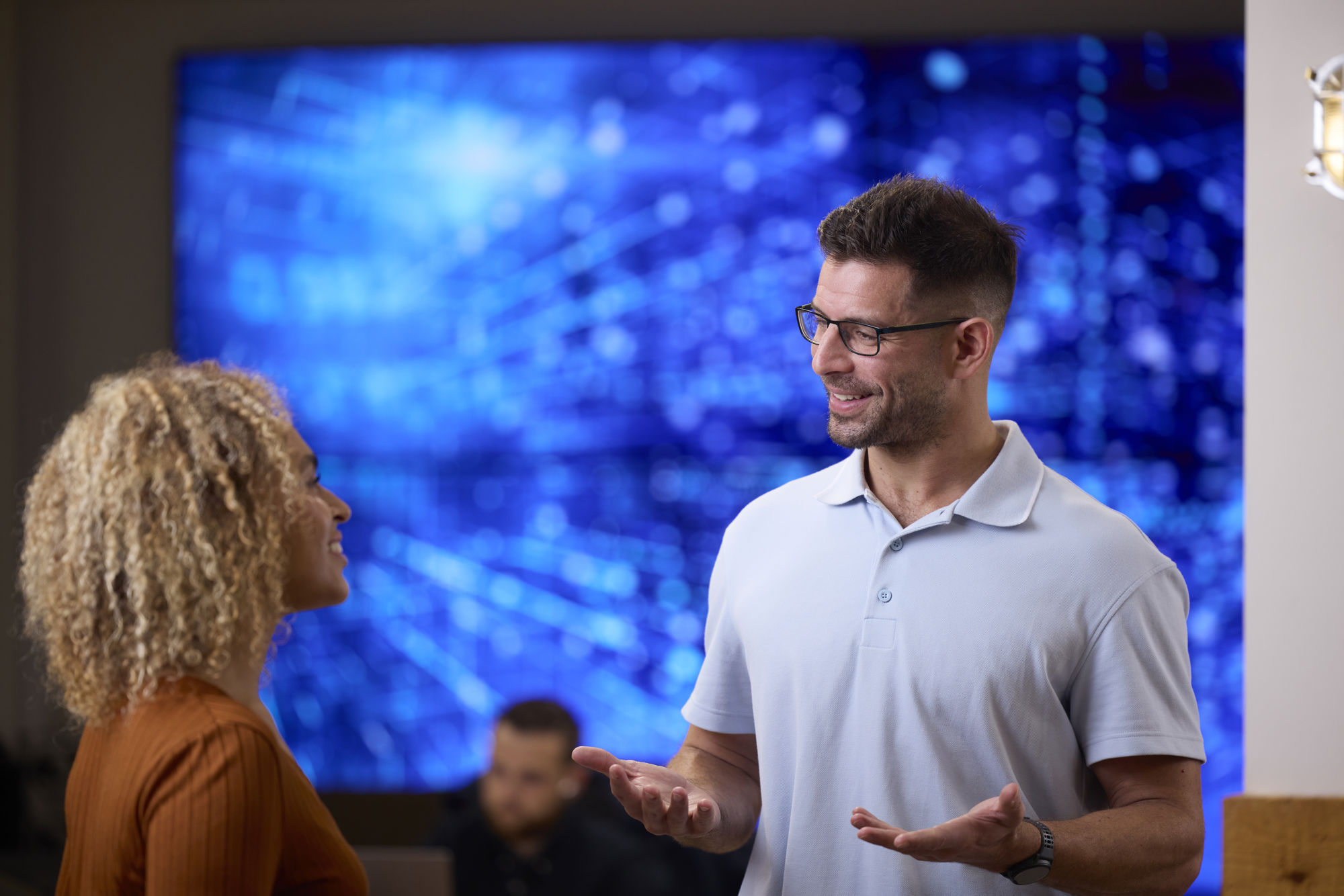 Man talking to woman